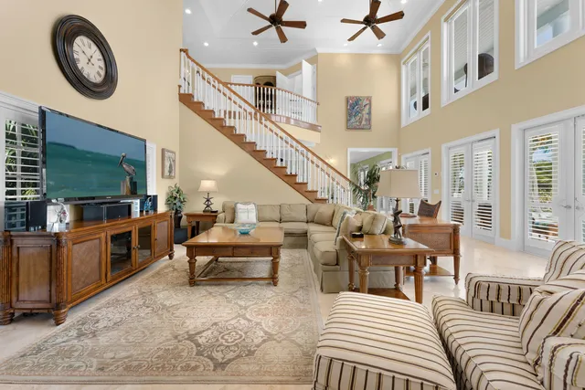 a view of a dining room with furniture a chandelier and wooden floor