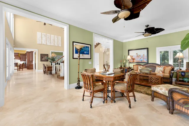 a kitchen with a table chairs and a chandelier