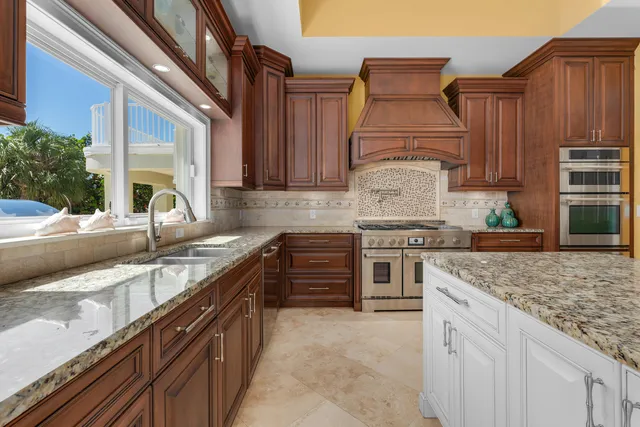 a bedroom with two beds and a painting on the wall