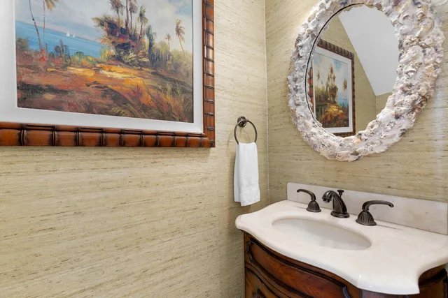 a bathroom with a granite countertop sink a toilet and shower