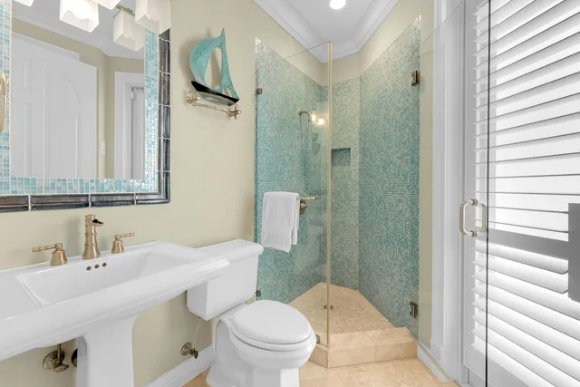 a bathroom with a granite countertop sink mirror and a bathtub