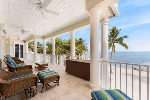 a spacious bedroom with a large bed and a large window