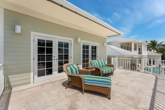 an aerial view of a houses with ocean view