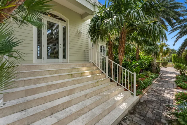 a living room with furniture a flat screen tv and a clock