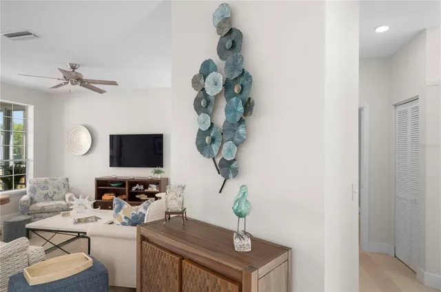 a view of living room with furniture and a potted plant