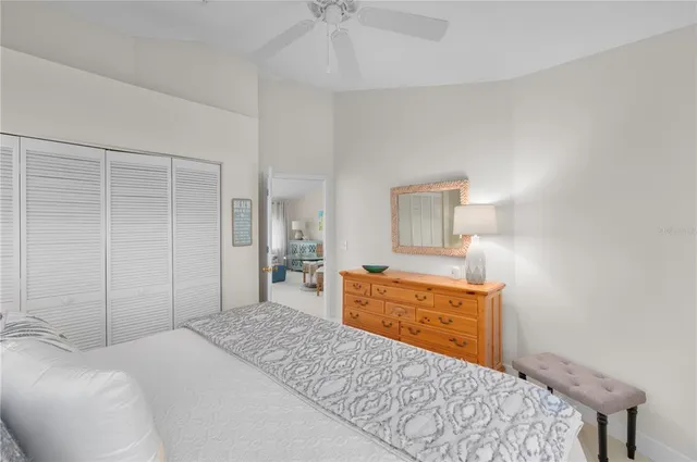 a bedroom with a bed and a dresser in it