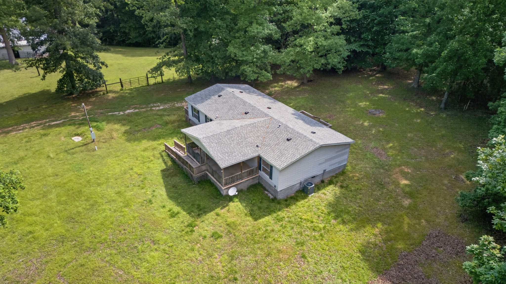 228 Shasteen Ridge Road Lynchburg, TN 37352 - Photo 2 of 53 an aerial view of a house with swimming pool and a yard