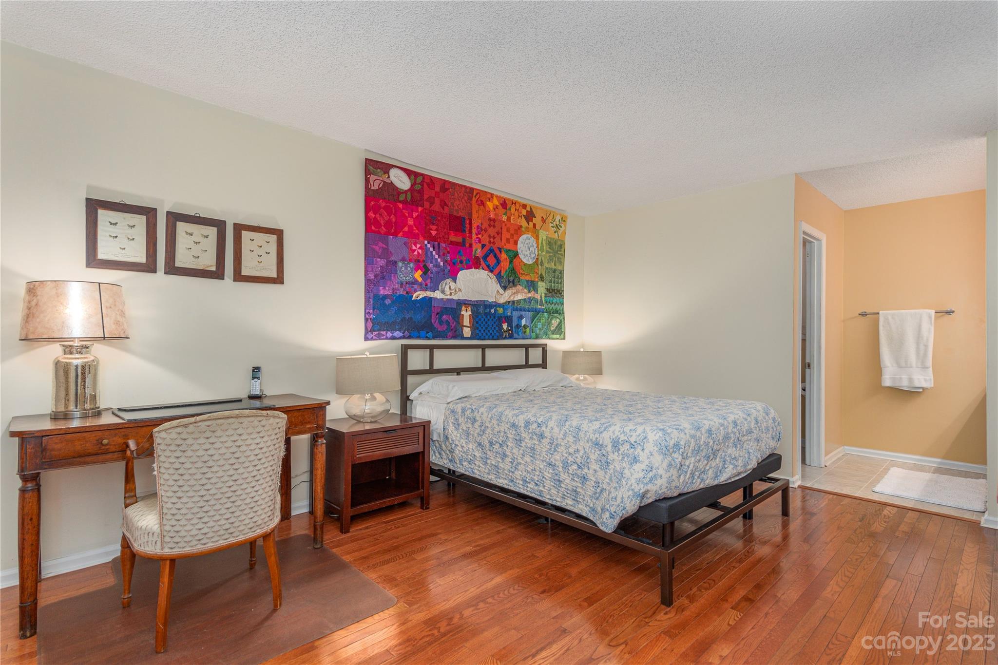 6 Cambridge Road Asheville, NC 28804 - Photo 13 of 35 a bedroom with furniture and a wooden floor
