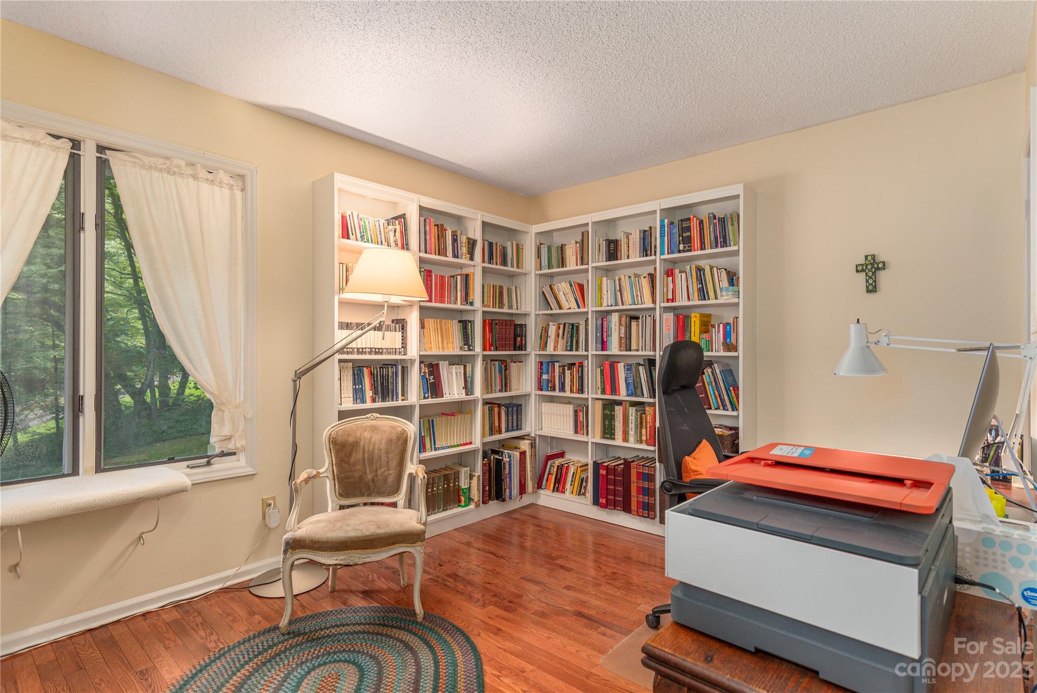 6 Cambridge Road Asheville, NC 28804 - Photo 18 of 35 a living room with furniture and a book shelf