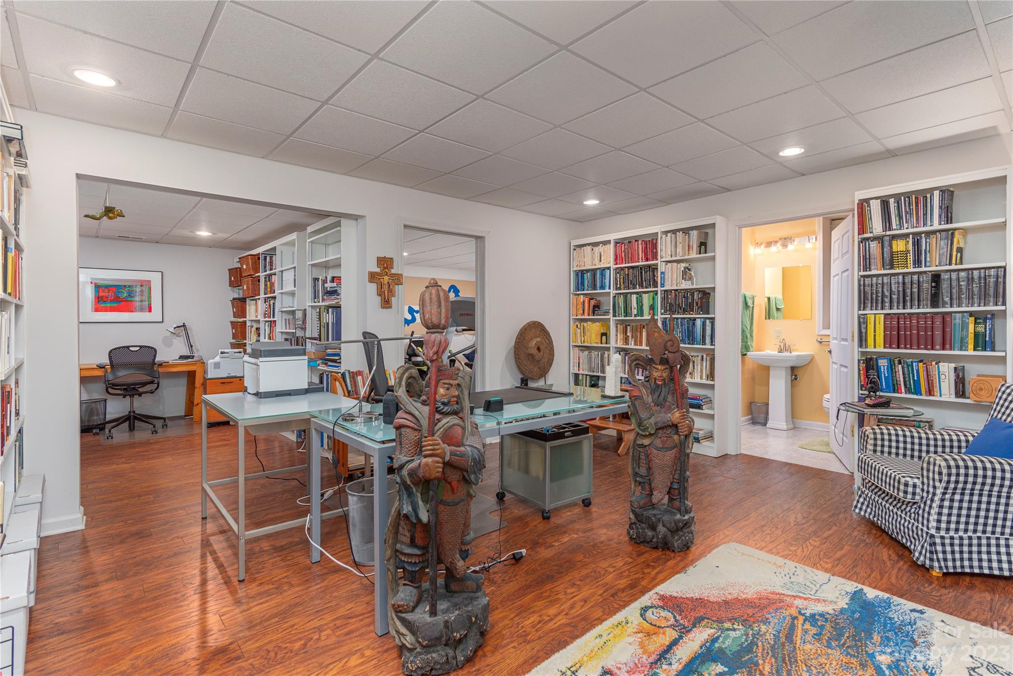 6 Cambridge Road Asheville, NC 28804 - Photo 19 of 35 a view of a livingroom with furniture and a book shelf