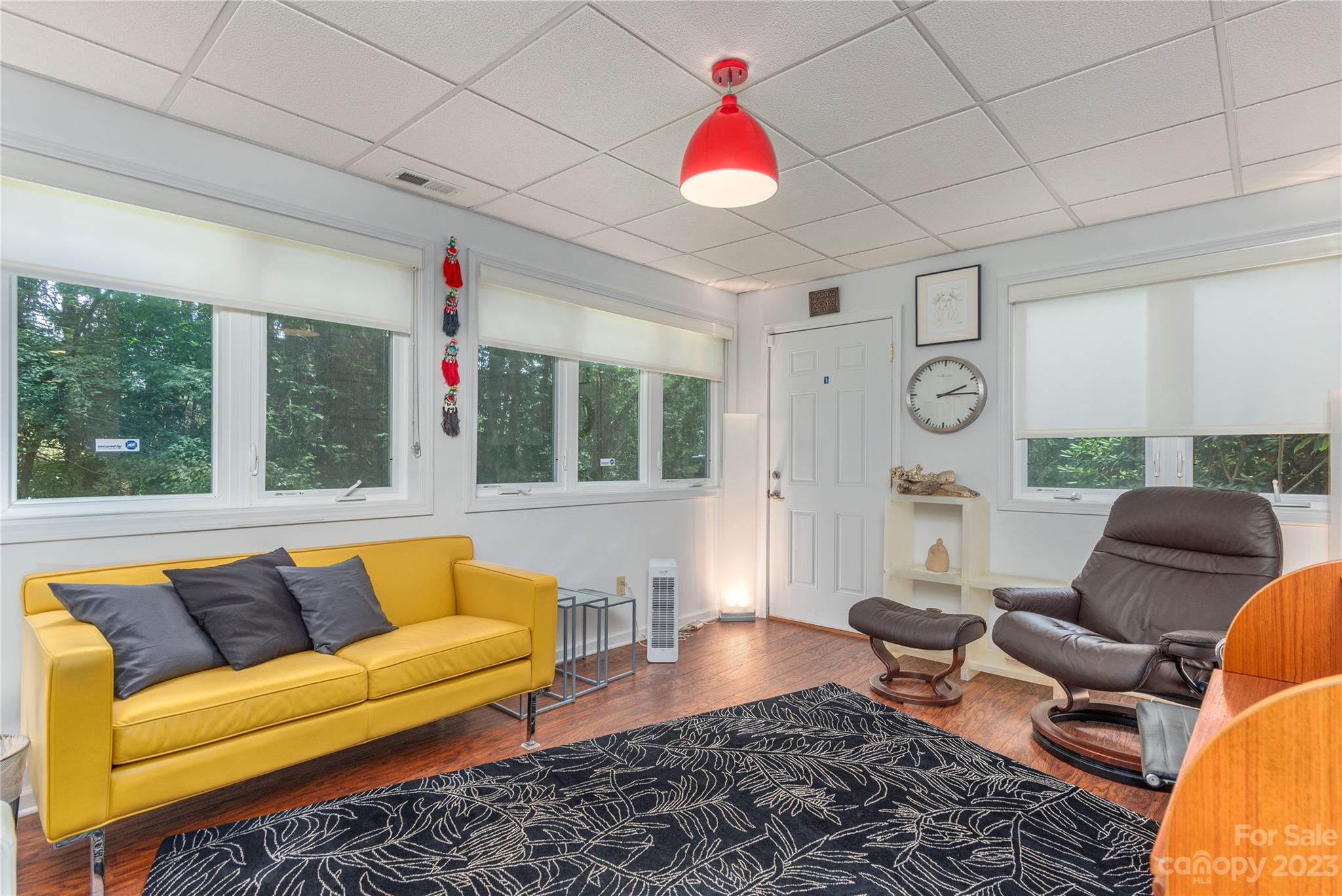 6 Cambridge Road Asheville, NC 28804 - Photo 24 of 35 a living room with furniture and a large window