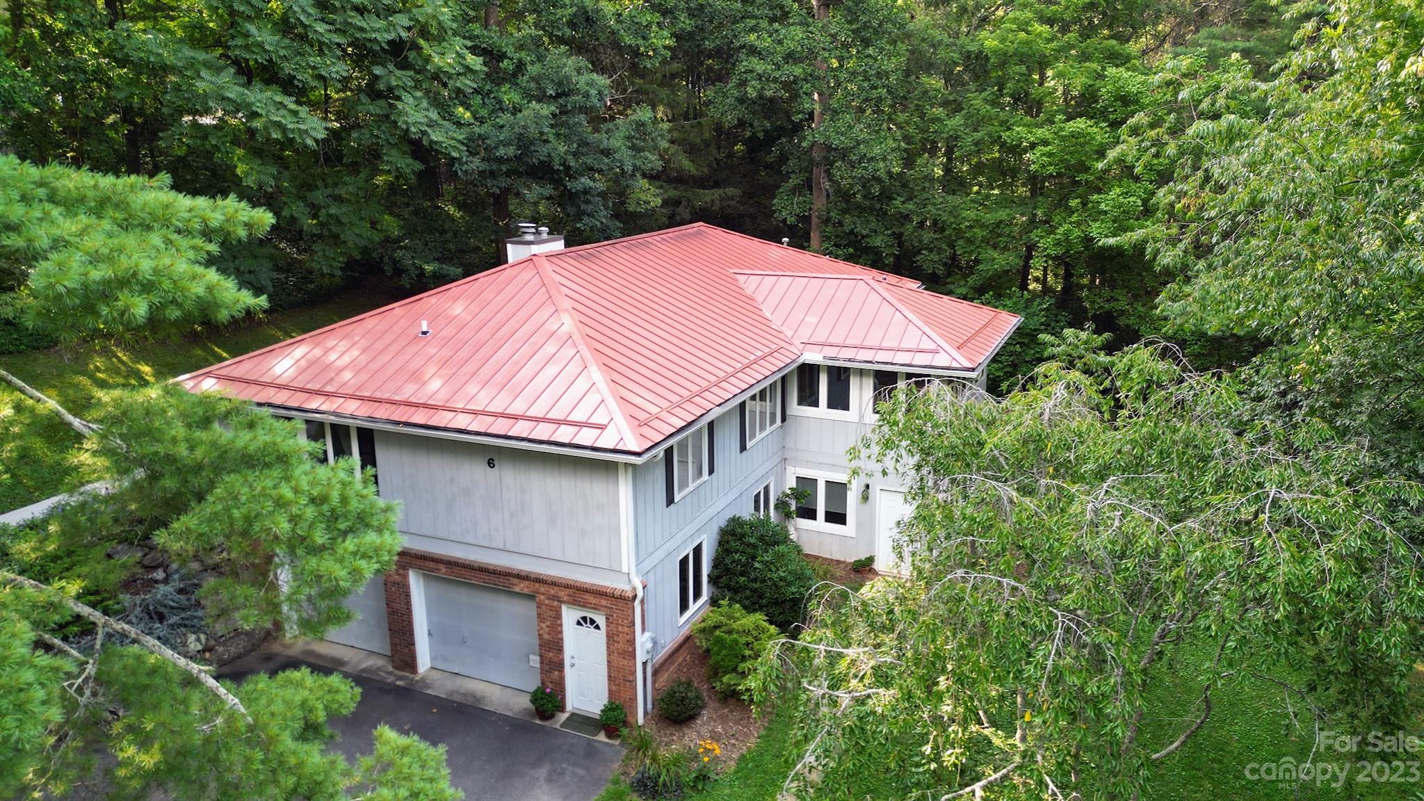 6 Cambridge Road Asheville, NC 28804 - Photo 32 of 35 a aerial view of a house with yard and trees in the background