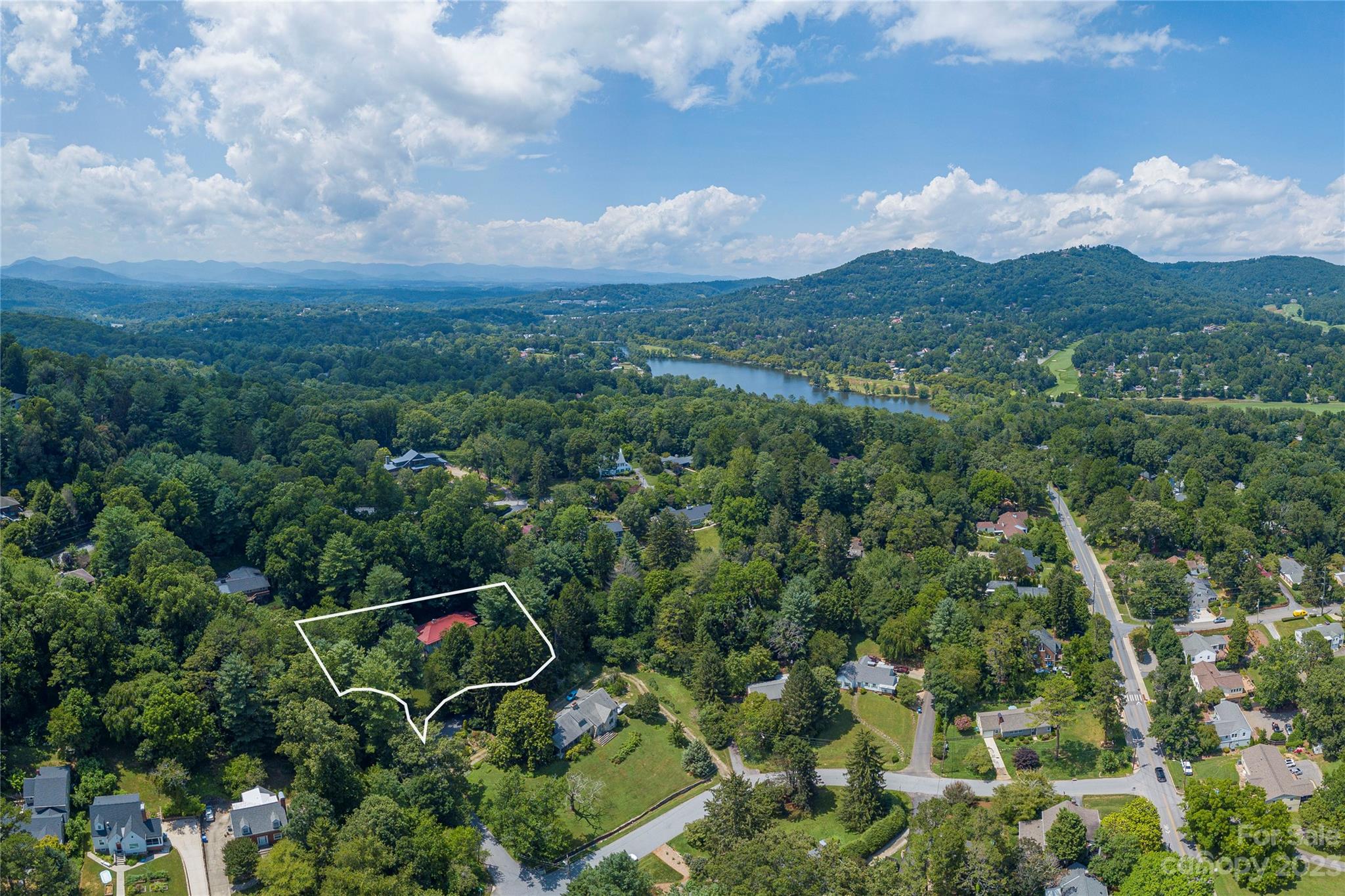 6 Cambridge Road Asheville, NC 28804 - Photo 35 of 35 a view of a city with lush green forest