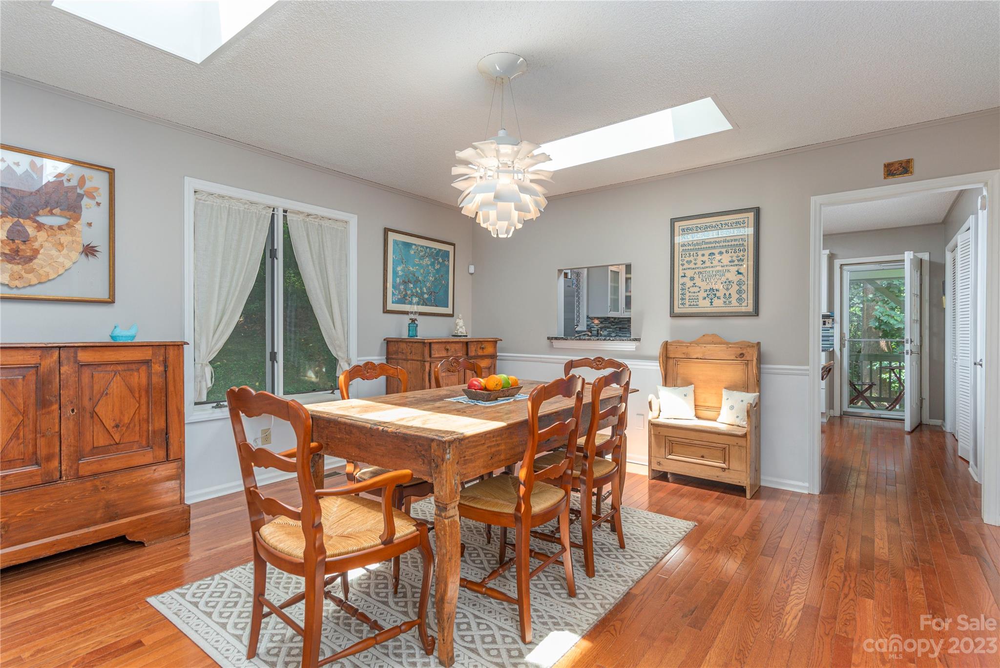 6 Cambridge Road Asheville, NC 28804 - Photo 8 of 35 a view of a dining room with furniture window and wooden floor