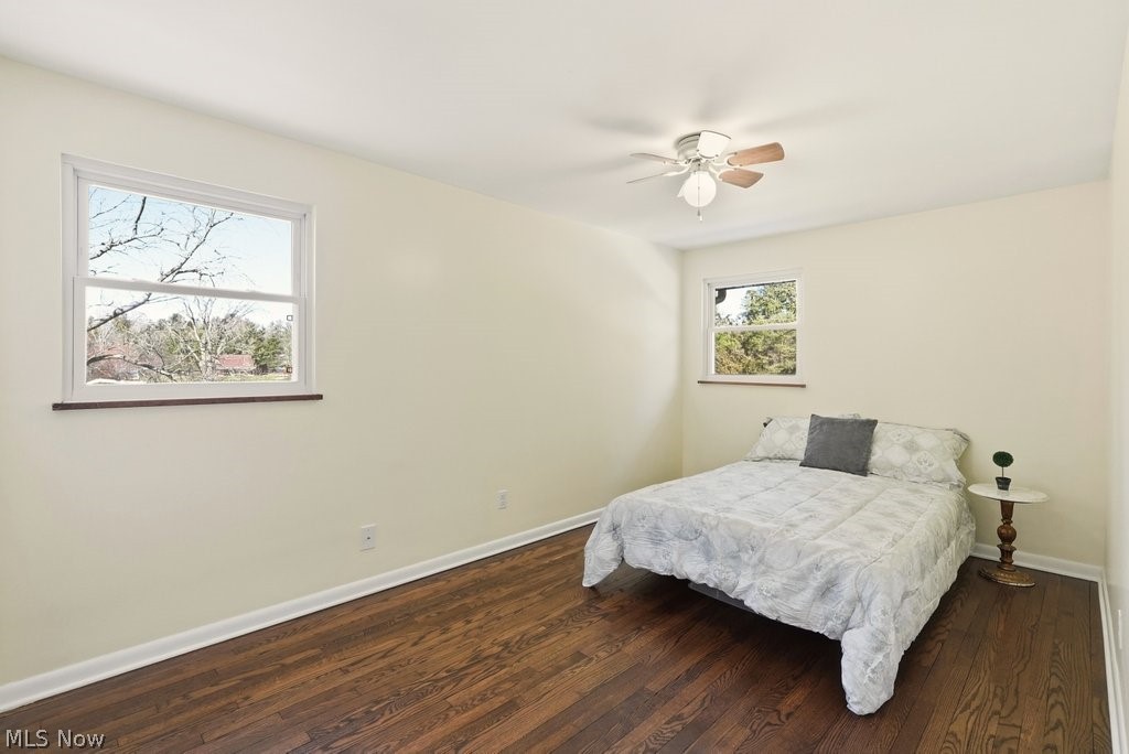 4699 West Bath Road Akron, OH 44333 - Photo 26 of 50 Bedroom featuring dark wood-type flooring and a ceiling fan