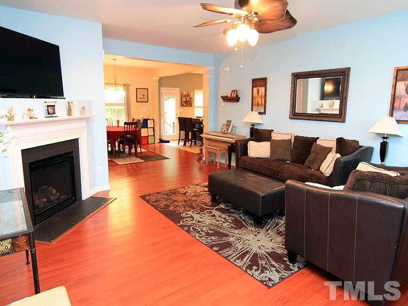 3505 Pinkham Way Raleigh, NC 27616 - Photo 2 of 24 a living room with furniture a flat screen tv and a fireplace