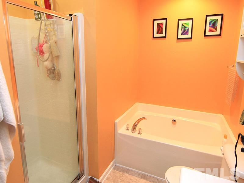 3505 Pinkham Way Raleigh, NC 27616 - Photo 15 of 24 a bathroom with a bathtub and shower