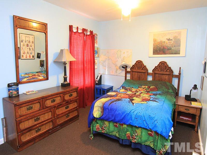 3505 Pinkham Way Raleigh, NC 27616 - Photo 16 of 24 a bedroom with bed and a dresser