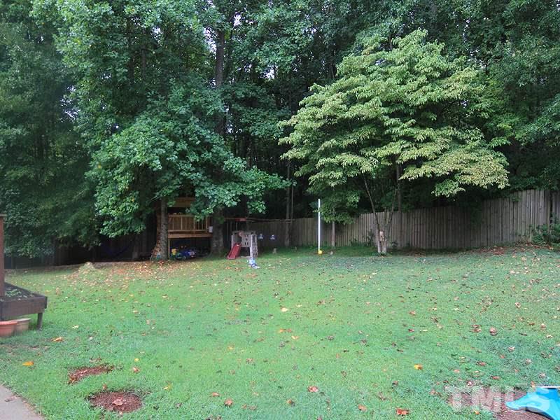 3505 Pinkham Way Raleigh, NC 27616 - Photo 20 of 24 a backyard of a house with lots of green space