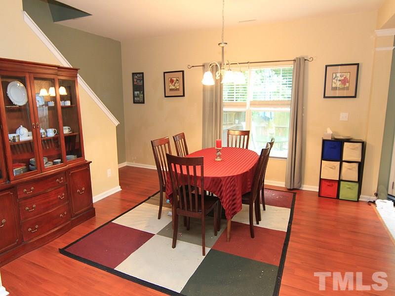 3505 Pinkham Way Raleigh, NC 27616 - Photo 3 of 24 a view of a dining room with furniture and chandelier