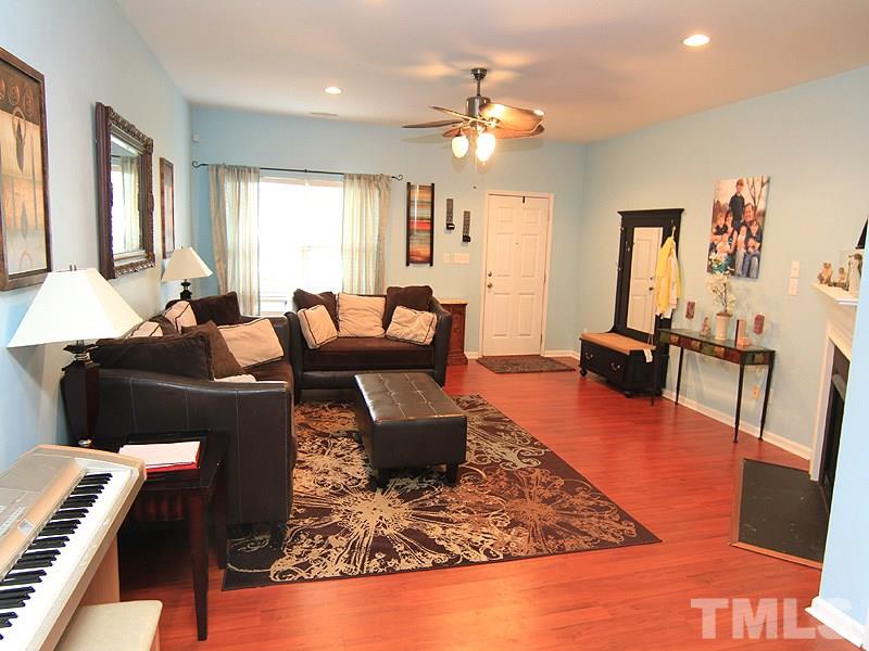 3505 Pinkham Way Raleigh, NC 27616 - Photo 7 of 24 a living room with furniture and a chandelier