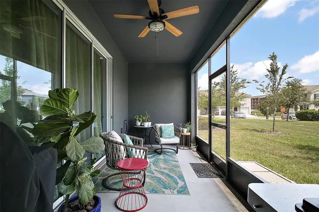 a dining room with furniture garden view and a potted plant