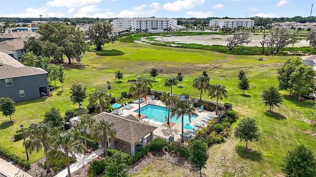 a view of a swimming pool with a yard