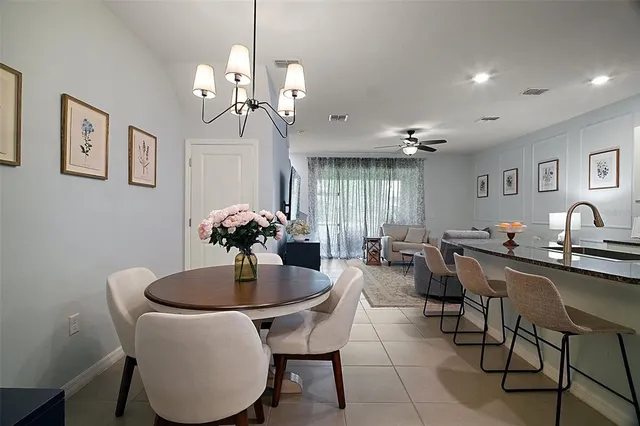 a dining room with furniture and window