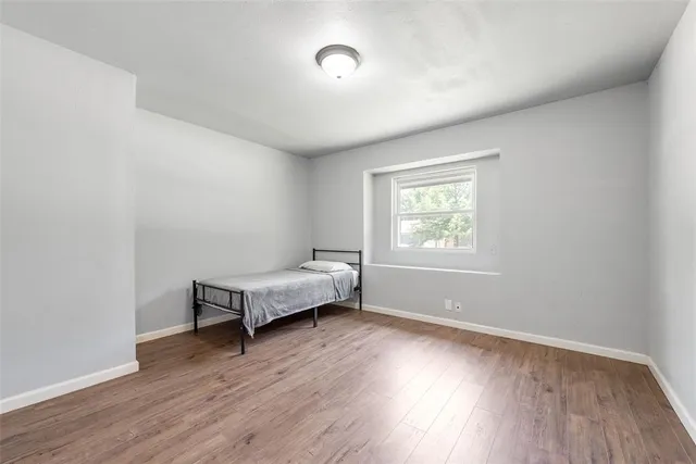 a bedroom with bed and window