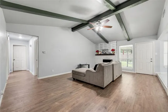 a room with cabinets and wooden floor