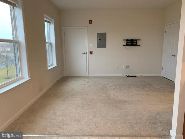 a view of an empty room with a window