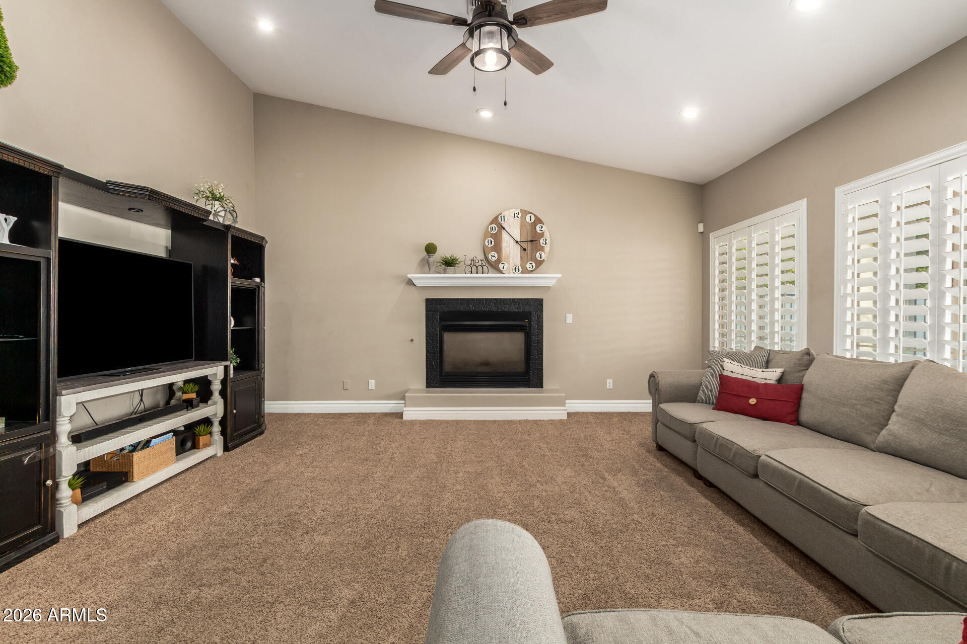 3528 East Decatur Street Mesa, AZ 85213 - Photo 12 of 55 a living room with furniture and a flat screen tv