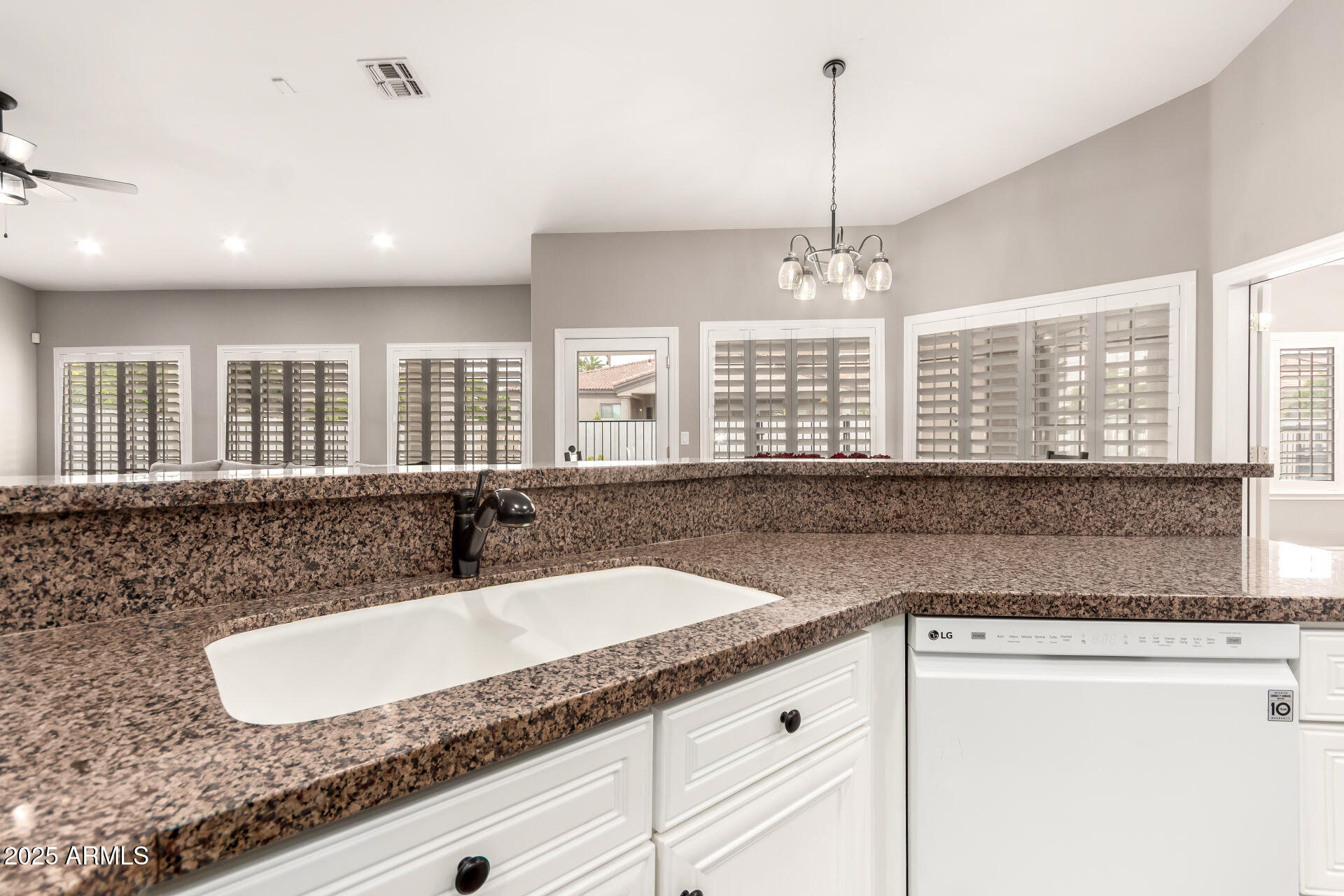 3528 East Decatur Street Mesa, AZ 85213 - Photo 18 of 55 a bathroom with a granite countertop double vanity and a large mirror