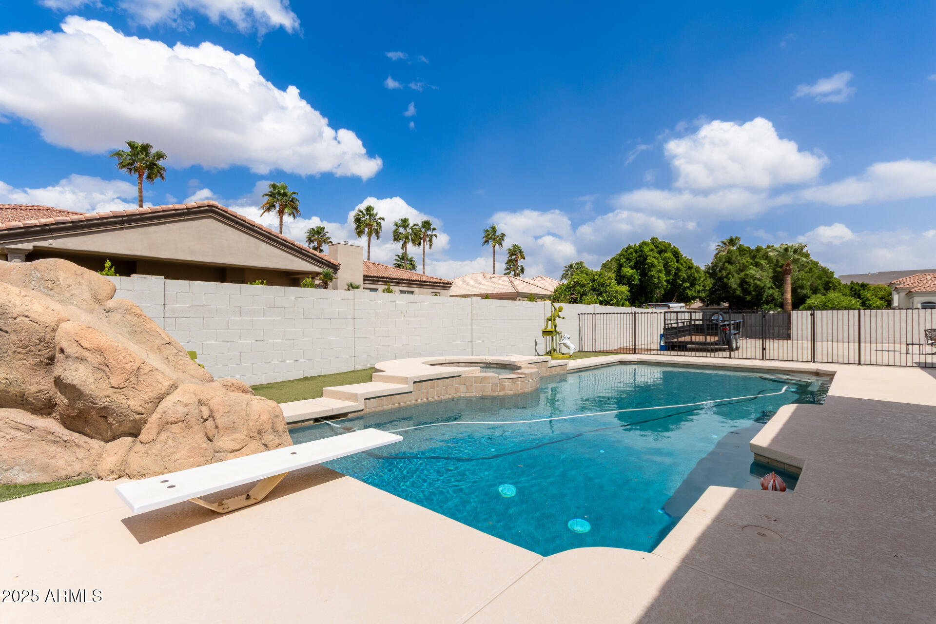 3528 East Decatur Street Mesa, AZ 85213 - Photo 2 of 55 a view of a swimming pool with a yard