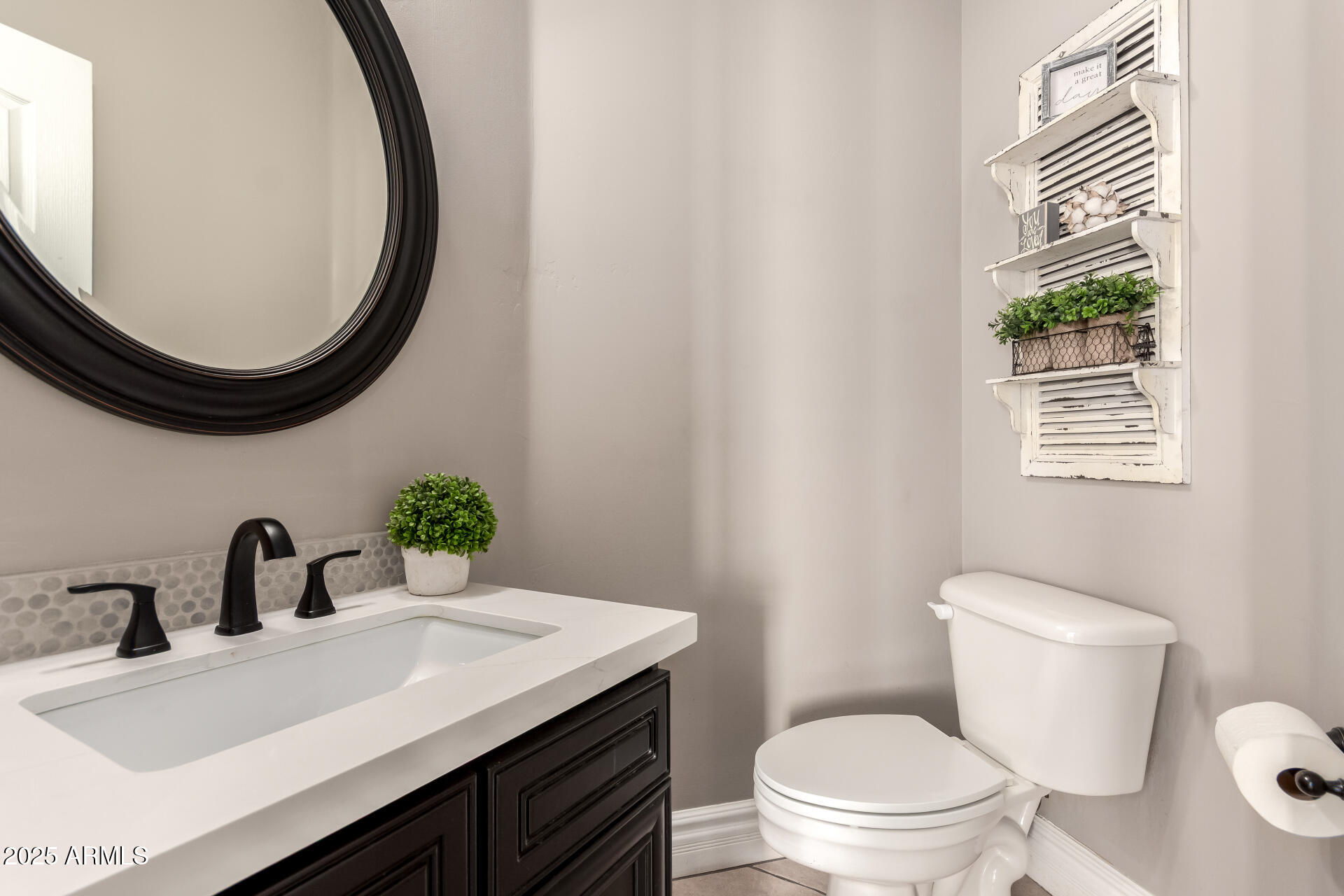 3528 East Decatur Street Mesa, AZ 85213 - Photo 21 of 55 a bathroom with a sink a toilet and a mirror