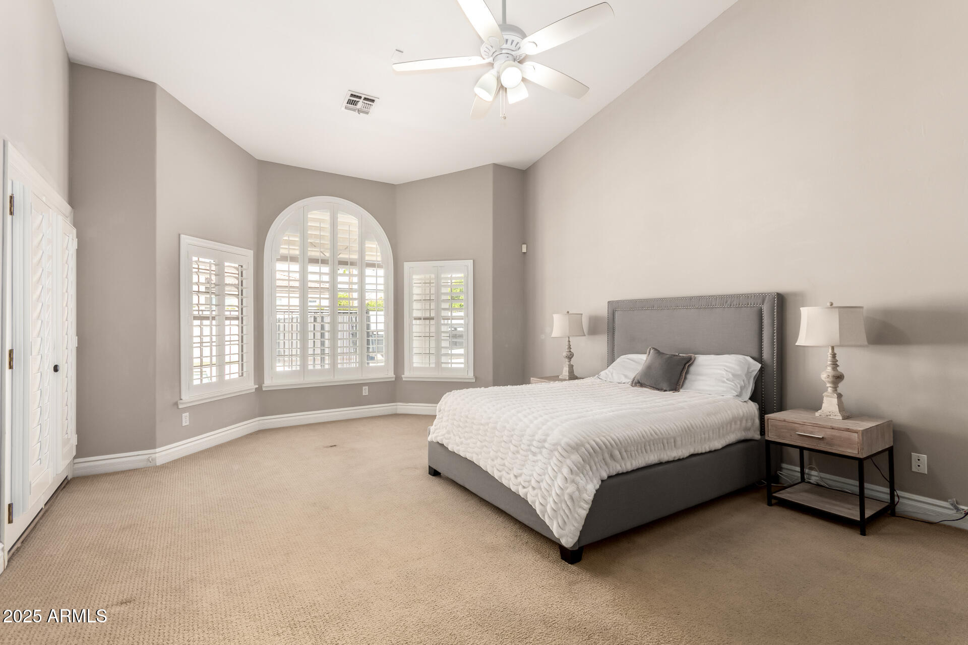3528 East Decatur Street Mesa, AZ 85213 - Photo 22 of 55 a bedroom with a bed and a large window
