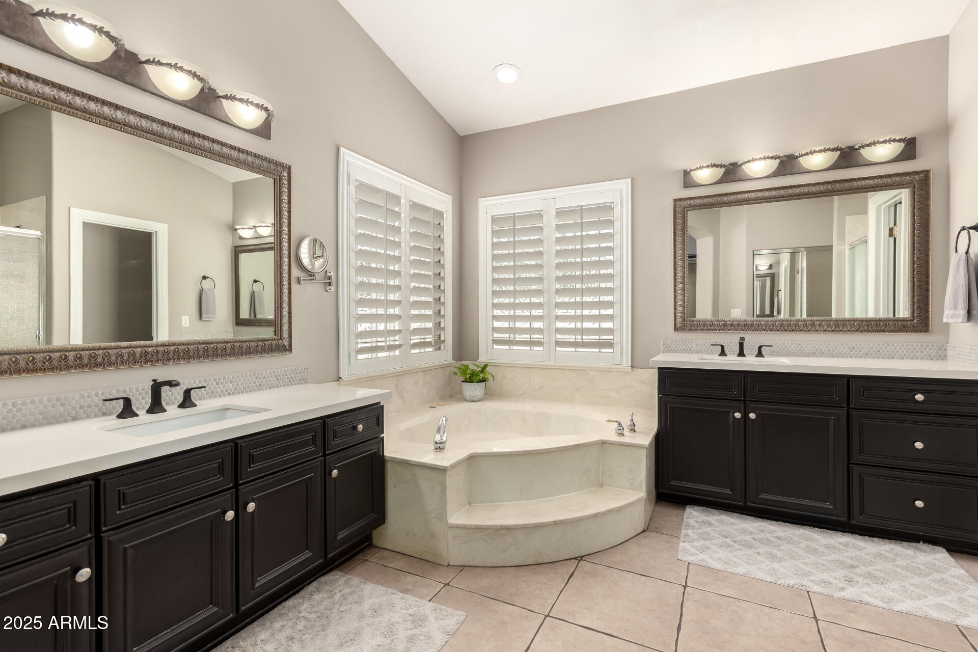 3528 East Decatur Street Mesa, AZ 85213 - Photo 25 of 55 a spacious bathroom with a tub double sink and mirror