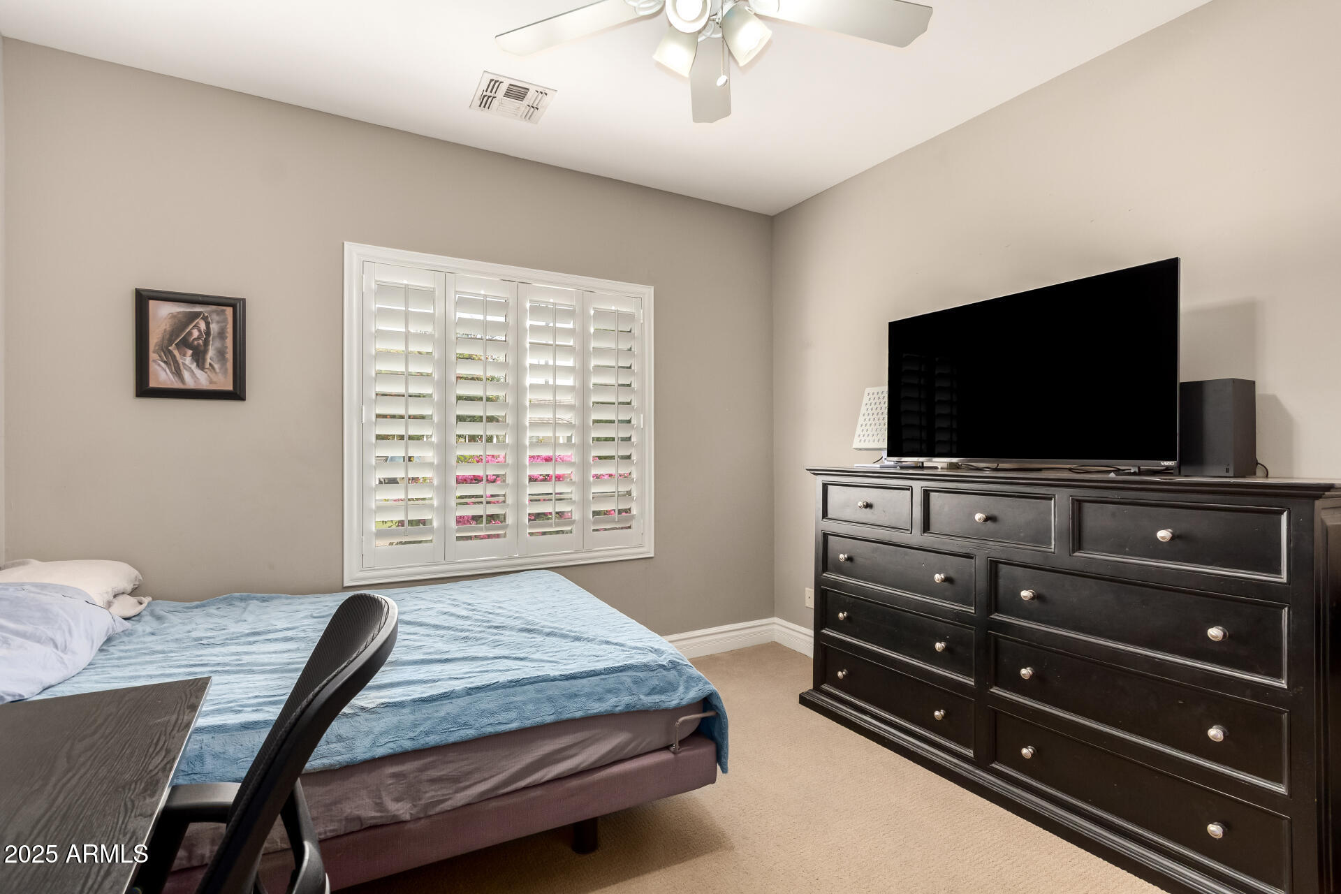 3528 East Decatur Street Mesa, AZ 85213 - Photo 29 of 55 a bedroom with a bed and a flat screen tv