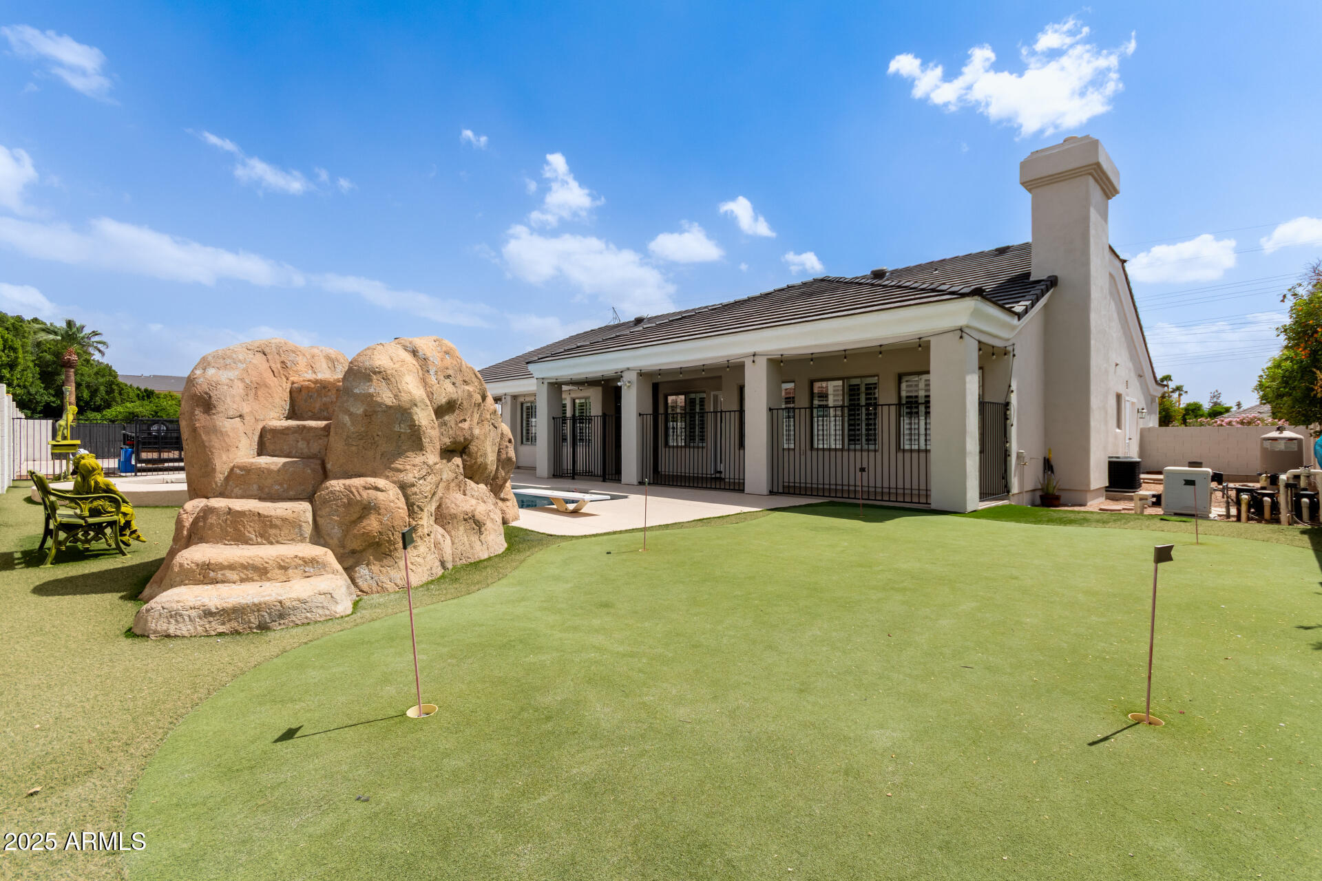 3528 East Decatur Street Mesa, AZ 85213 - Photo 3 of 55 a view of a house with backyard porch and furniture