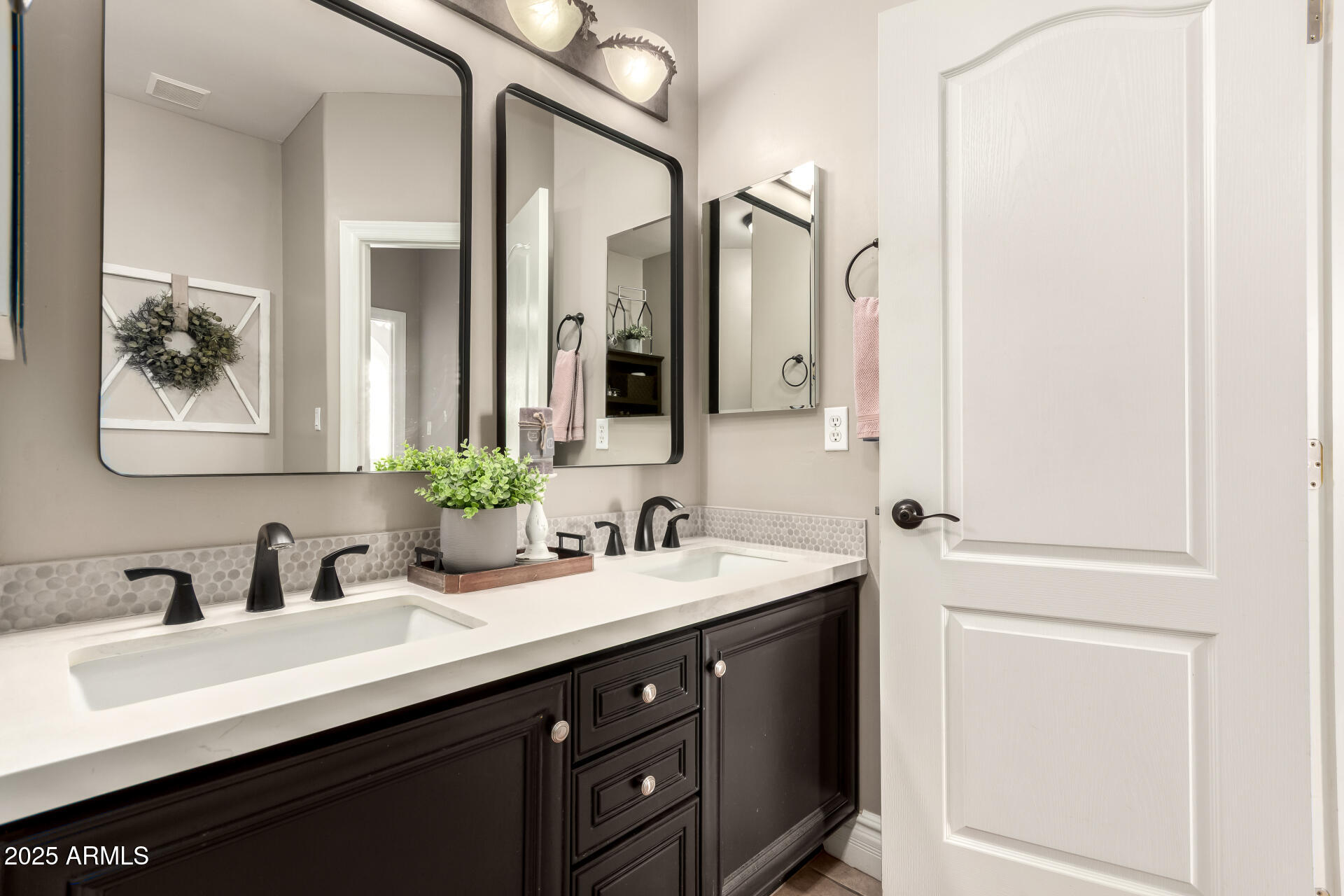 3528 East Decatur Street Mesa, AZ 85213 - Photo 32 of 55 a bathroom with a double vanity sink and a mirror