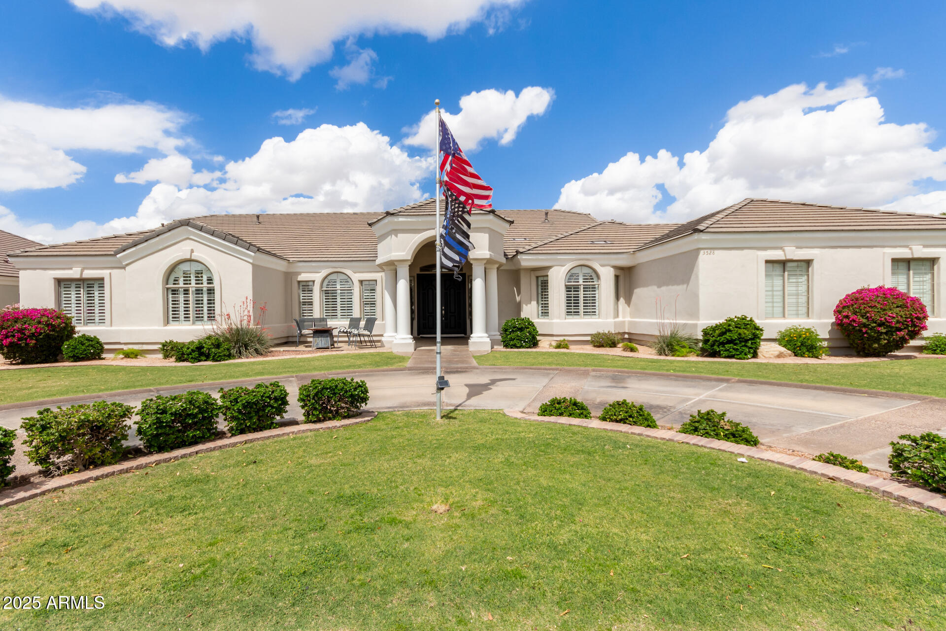 3528 East Decatur Street Mesa, AZ 85213 - Photo 4 of 55 a view of white house with a big yard and potted plants