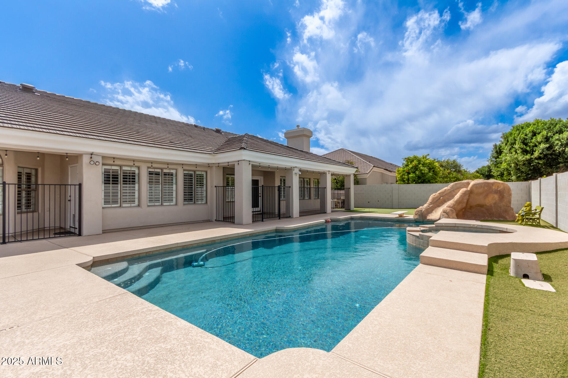 3528 East Decatur Street Mesa, AZ 85213 - Photo 42 of 55 a view of a house with a backyard
