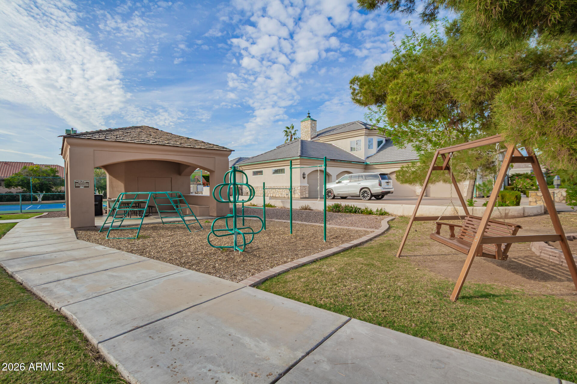 3528 East Decatur Street Mesa, AZ 85213 - Photo 49 of 55 a backyard of a house with table and chairs