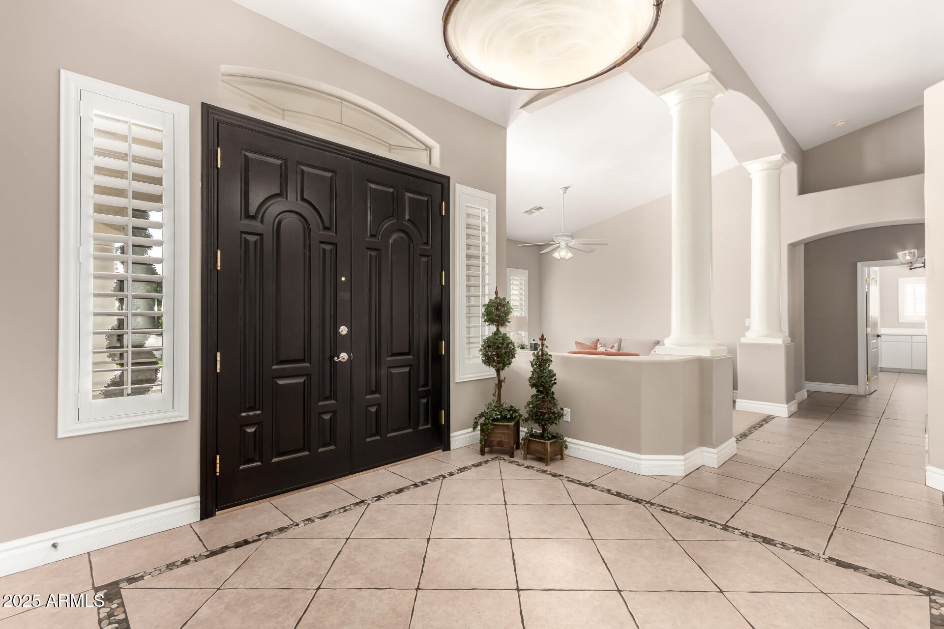 3528 East Decatur Street Mesa, AZ 85213 - Photo 6 of 55 a view of a bathroom with a tub and shower doors