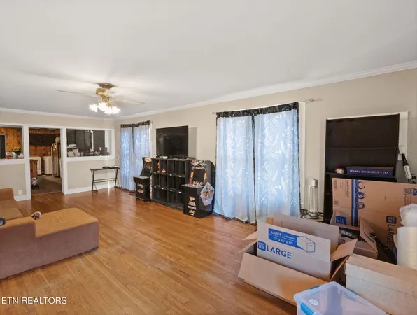 a living room with furniture and a flat screen tv