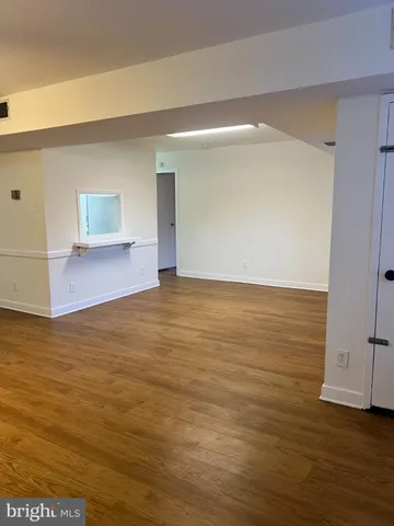 a view of room and wooden floor