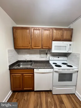 a kitchen with a stove and a sink