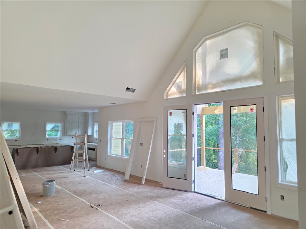 107 Abaco Lane Seneca, SC 29672 - Photo 6 of 28 An airy living space with soaring ceilings and abundant natural light invites outdoor living from a private deck.