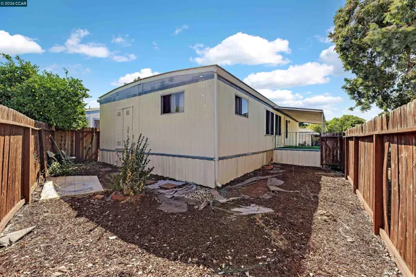 a house view with a backyard space