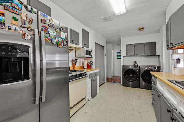 a kitchen with a sink cabinets and a window